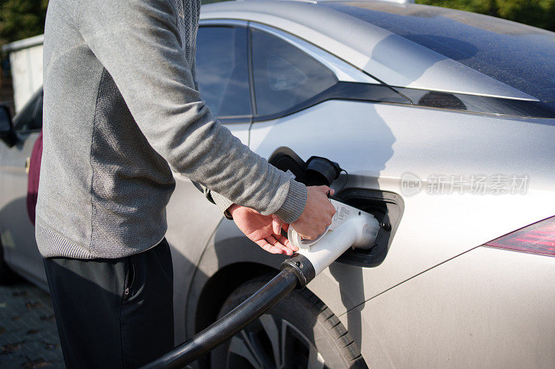 Charging a car close-up